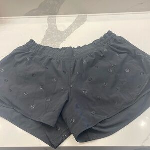 Black hottie shorts with lulullemon logo on them. Size 14 tall